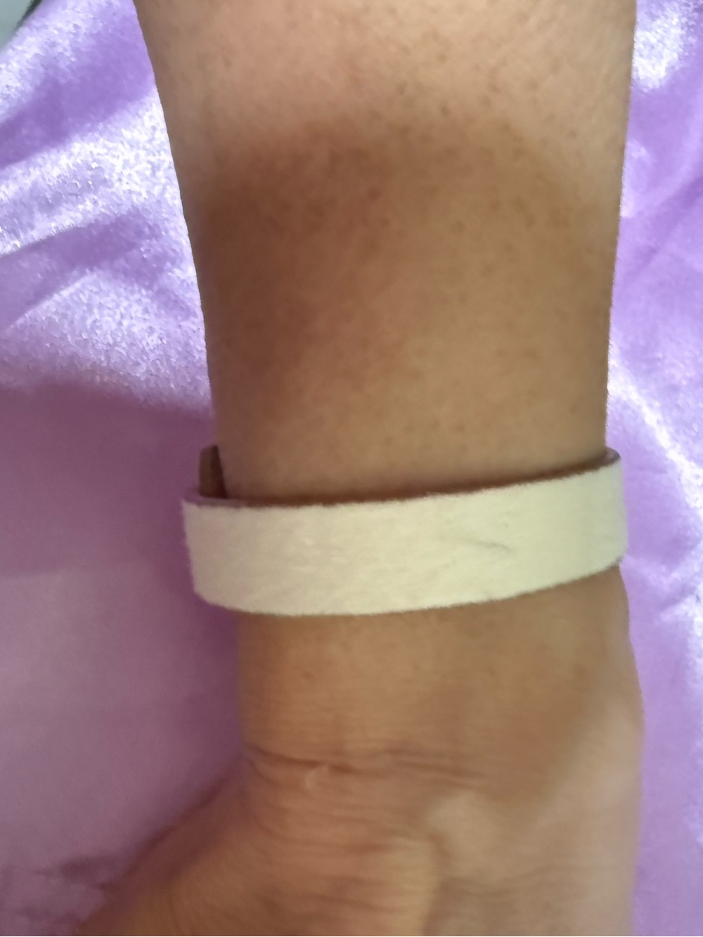 White leather strap bracelet with gold hardware
